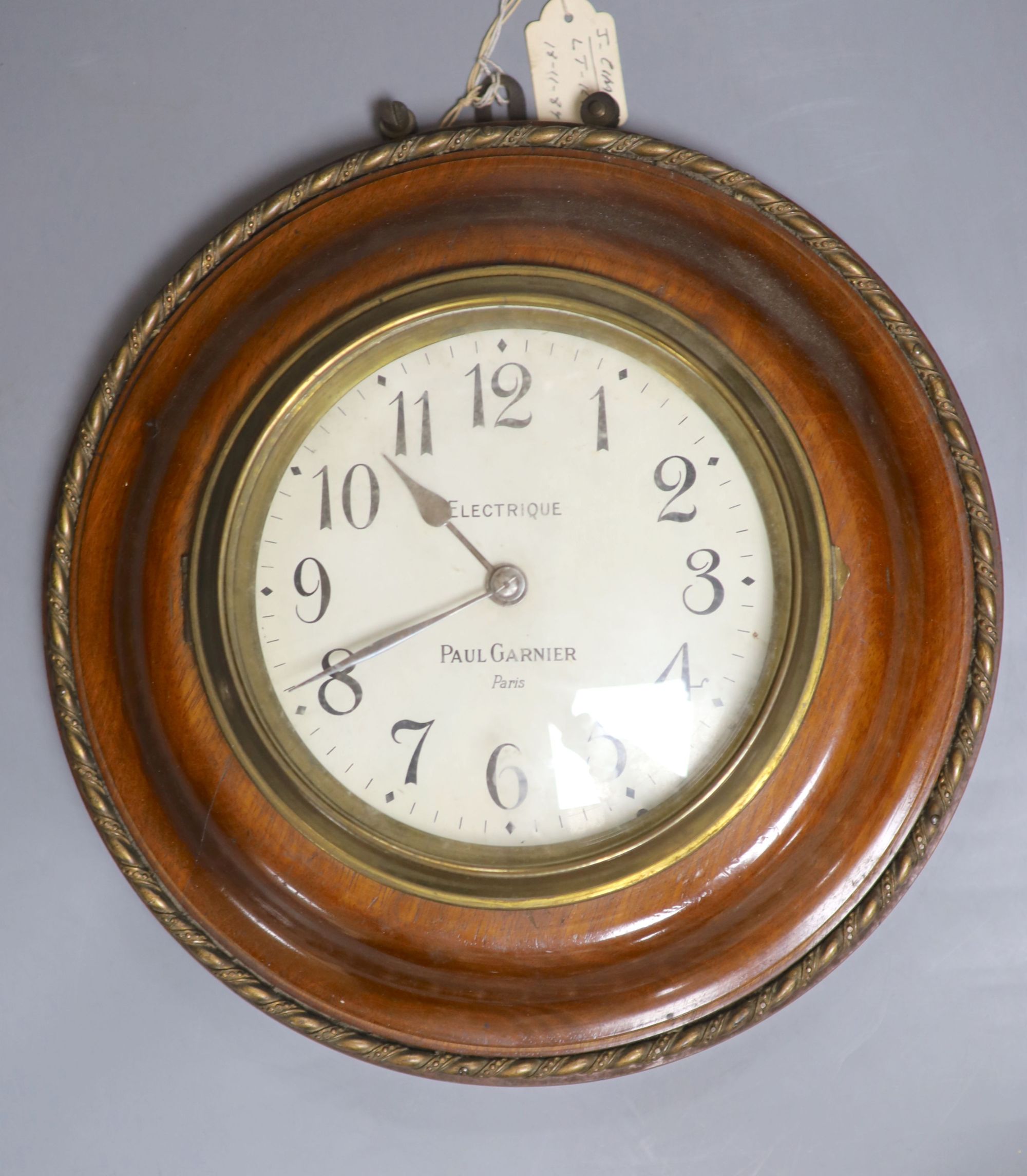 A Paul Garnier electrique mahogany wall slave clock, diameter 29cm